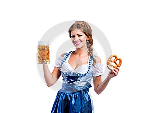 Woman in traditional bavarian dress holding beer and pretzel