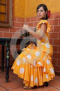 Woman in traditional flamenco dresses dance during the Feria de Abril on April Spain