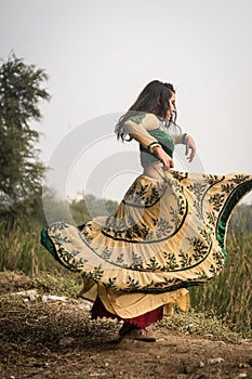 Woman in traditional Indian costume lehenga choli or sari or saree