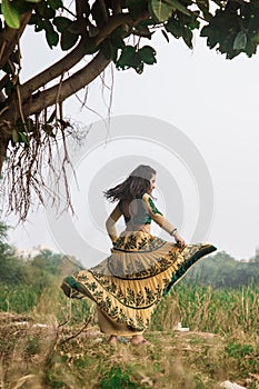 Woman in traditional Indian costume lehenga choli or sari or saree