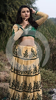 Woman in traditional Indian costume lehenga choli or sari or saree