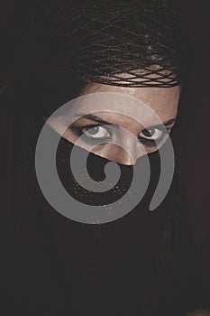 Woman in traditional Islamic veil, burka, beautiful and deep loo