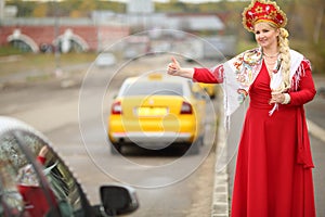 Woman in traditional russian clothes and kokoshnik photo