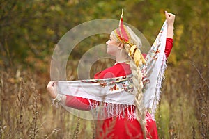 Woman in traditional russian kokoshnik with photo