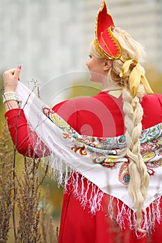 Woman in traditional russian kokoshnik with photo
