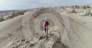 Woman trail runner cross country running on desert