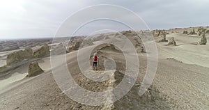 Woman trail runner cross country running on desert