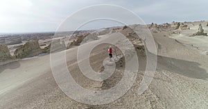 Woman trail runner cross country running on desert