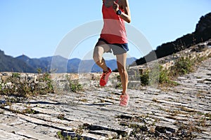 Woman trail runner running on the great wall