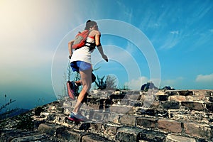 Woman trail runner running at great wall