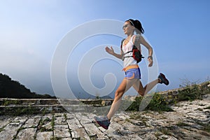 Woman trail runner running at great wall
