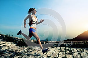 Woman trail runner running at great wall