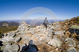 Woman trail running in the mountains