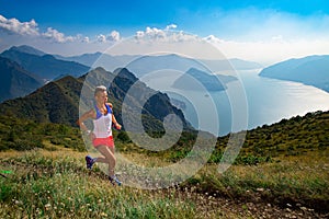 Woman trail running in the mountains athlete trains