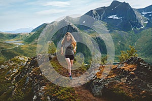 Woman trail running in mountains outdoor travel healthy lifestyle