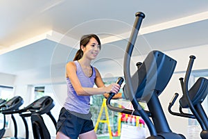 Woman training on Elliptical Cross Trainer