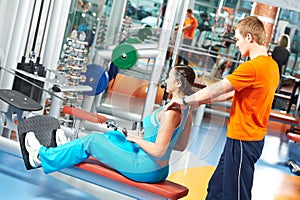 Woman with trainer at training simulator photo