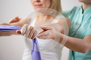 Woman training with exercise band