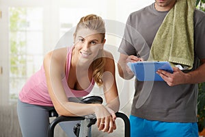 Woman training on exercise bike