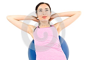 Woman training her abs on pilates ball
