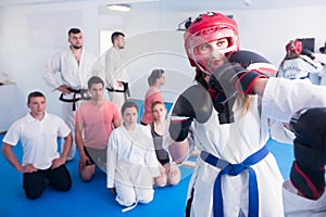 Woman training new taekwondo holds