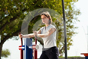 Woman training on outside sport ground in the morning.