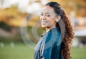 Woman, training and portrait in field, smile and excited for running, fitness or wellness in summer. Sports girl, happy