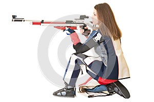 Woman training sport shooting with air rifle gun