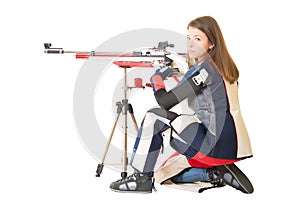 Woman training sport shooting with air rifle gun