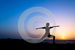 Woman training yoga pose silhouette