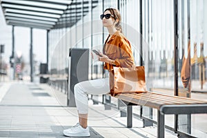 Woman at the transport stop