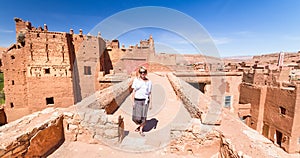 Woman on travel at Ait Benhaddou kasbah, Ouarzazate, Morocco.