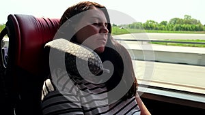 woman travel on bus sleeping with a pillow