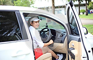 Woman travel by car to golf, woman loading a golf bag