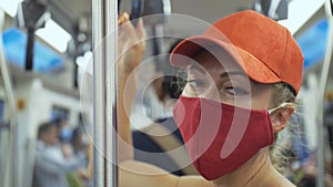 Woman travel caucasian ride at overground train airtrain with wearing protective medical mask. Girl tourist at airtrain