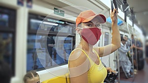 Woman travel caucasian ride at overground train airtrain with wearing protective medical mask. Girl tourist at airtrain