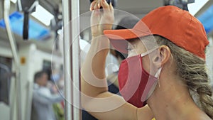 Woman travel caucasian ride at overground train airtrain with wearing protective medical mask. Girl tourist at airtrain