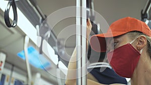 Woman travel caucasian ride at overground train airtrain with wearing protective medical mask. Girl tourist at airtrain