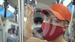 Woman travel caucasian ride at overground train airtrain with wearing protective medical mask. Girl tourist at airtrain