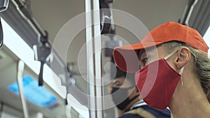 Woman travel caucasian ride at overground train airtrain with wearing protective medical mask. Girl tourist at airtrain