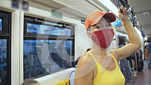 Woman travel caucasian ride at overground train airtrain with wearing protective medical mask. Girl tourist at airtrain