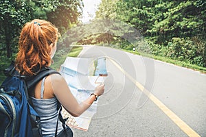 Woman  travel. Female travelers travel nature view map on the road
