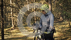 The woman travel on mixed terrain cycle touring with bike bikepacking. The traveler journey with bicycle bags. Magic