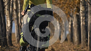 The woman travel on mixed terrain cycle touring with bikepacking. The traveler journey with bicycle bags. Sport tourism