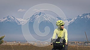 The woman travel on mixed terrain cycle touring with bikepacking. The traveler journey with bicycle bags. Sport tourism