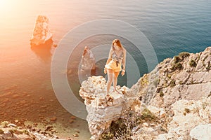 Woman travel sea. Happy tourist enjoy taking picture outdoors for memories. Woman traveler looks at the edge of the