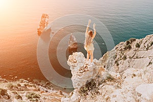 Woman travel sea. Happy tourist enjoy taking picture outdoors for memories. Woman traveler looks at the edge of the