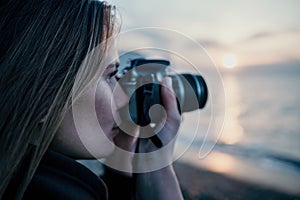 Woman travel sea. Happy tourist enjoy taking picture outdoors for memories. Woman traveler looks at sea bay of mountains