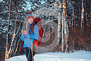 Woman Traveler with backpack hiking Travel Lifestyle adventure concept active vacations outdoor. Beautiful landscape forest