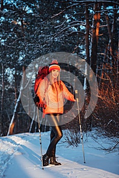 Woman Traveler with backpack hiking Travel Lifestyle adventure concept active vacations outdoor. Beautiful landscape forest